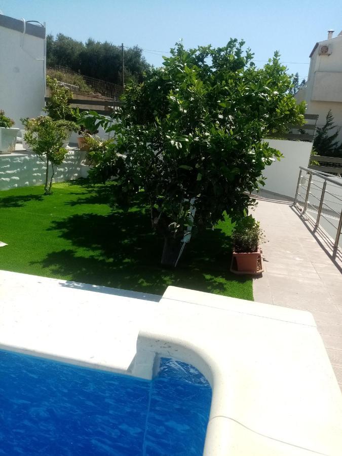 Rose Garden Apartments Pigí Buitenkant foto